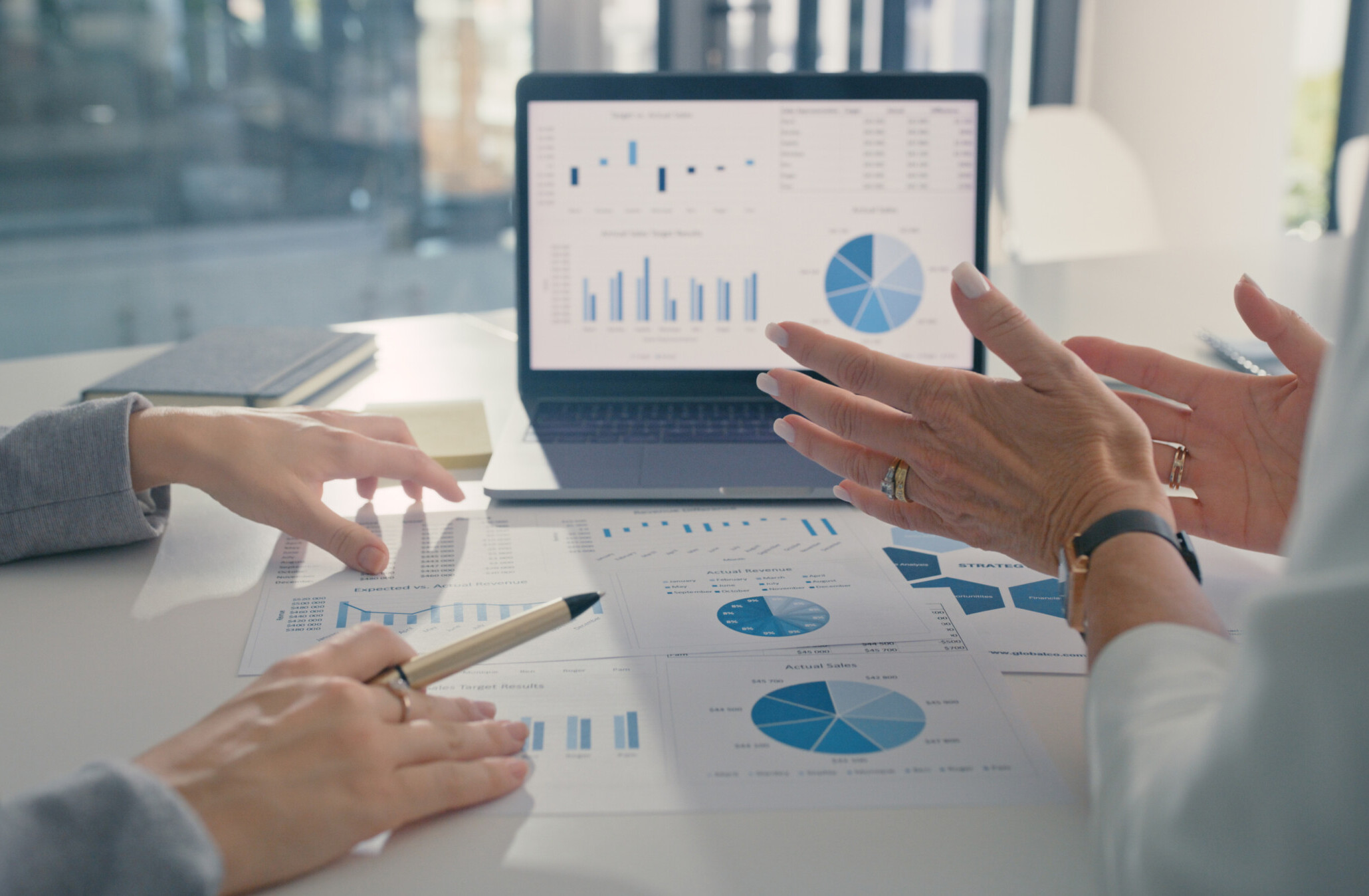 Data analysis, marketing strategy or statistics by business development leaders planning company growth. Hands of finance managers in a meeting talking about financial performance in an office Data analysis, marketing strategy or statistics by business development leaders planning company growth. Hands of finance managers in a meeting talking about financial performance in an office